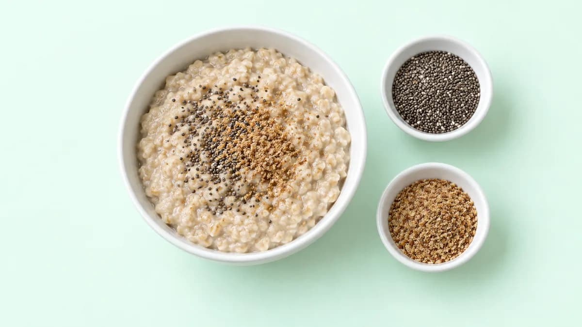 Instant oats with chia seeds and flaxseeds on a light green background